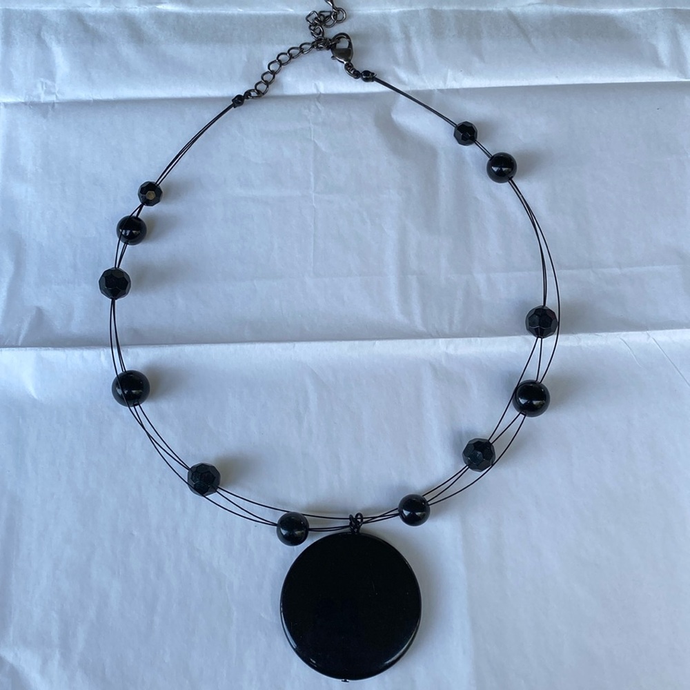 Black plastic beads with silver clasp